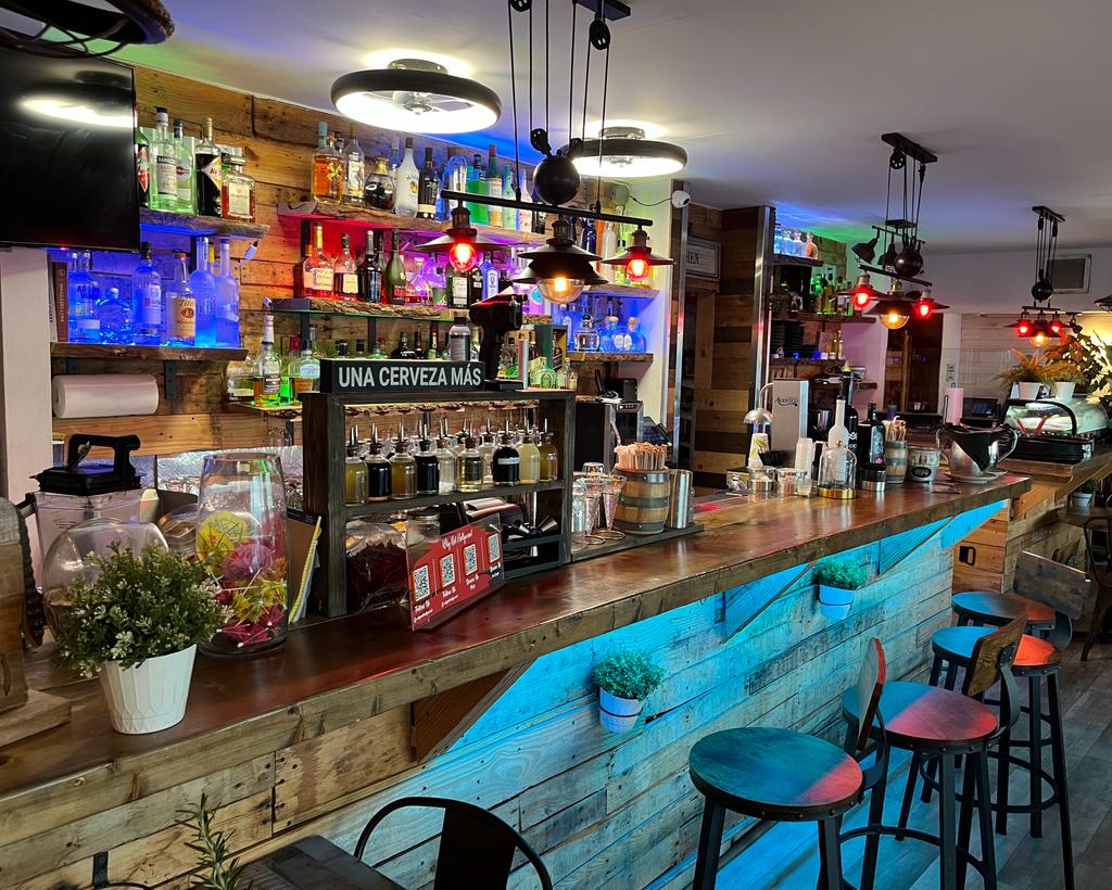 The reclaimed-wood bar inside Why Not? on Hollywood Beach